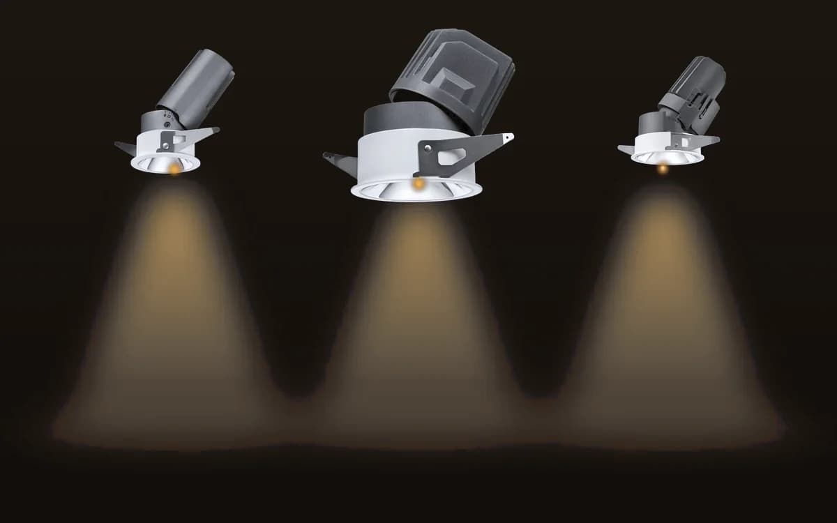 Three recessed LED downlights, each throwing a warm cone of light